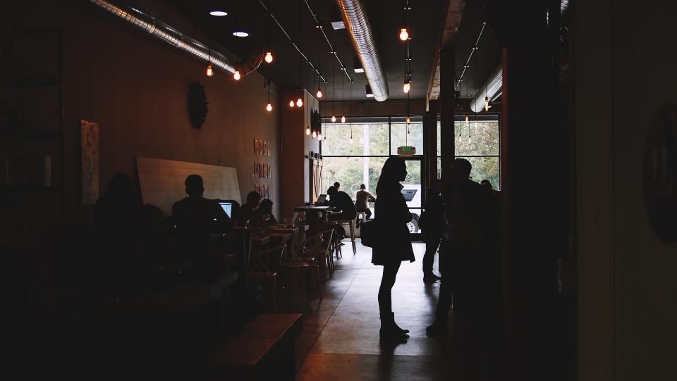 The cafe counter with stools alongside