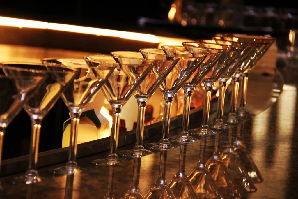 A cocktail being finished at the bar