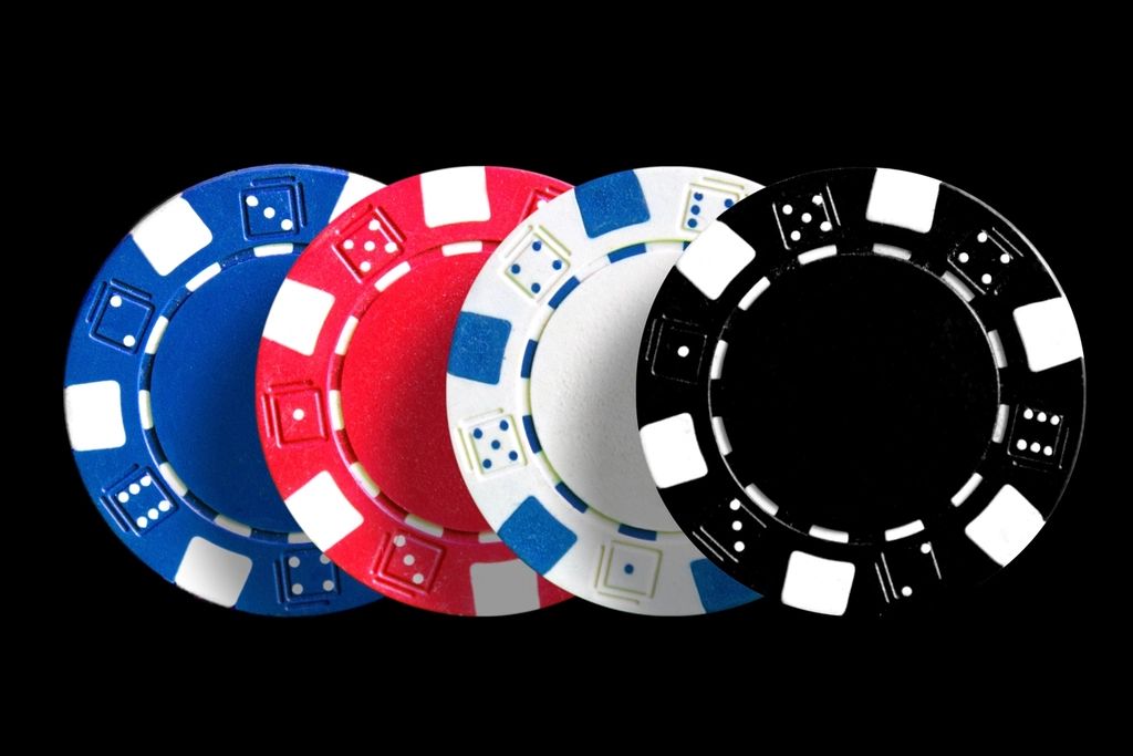 Gaming chips and cards on the table felt