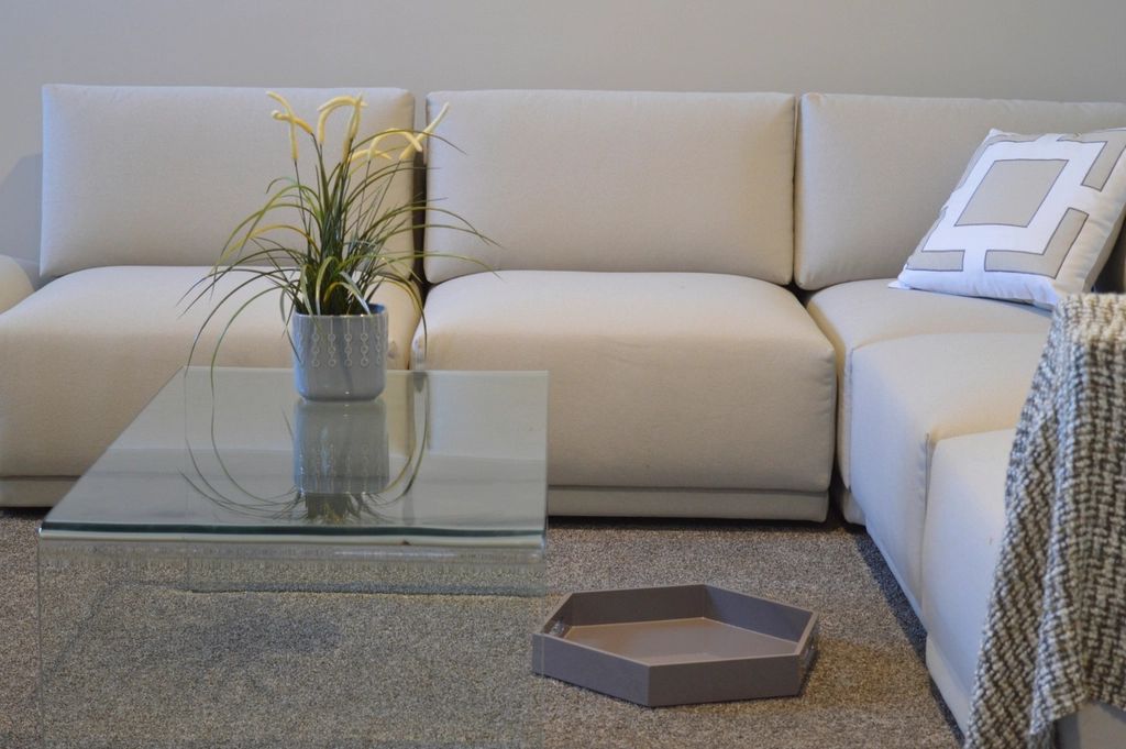 A suite sitting room with a sofa and armchairs